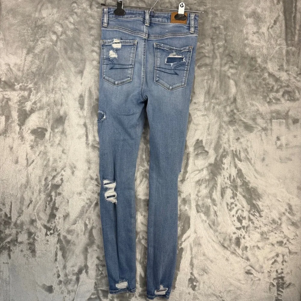American Eagle Super Hi-Rise Jegging Distressed Blue Jeans Next Level Stretch 0